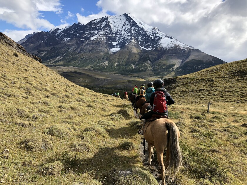 A group goes horseback riding with Women's Quest.