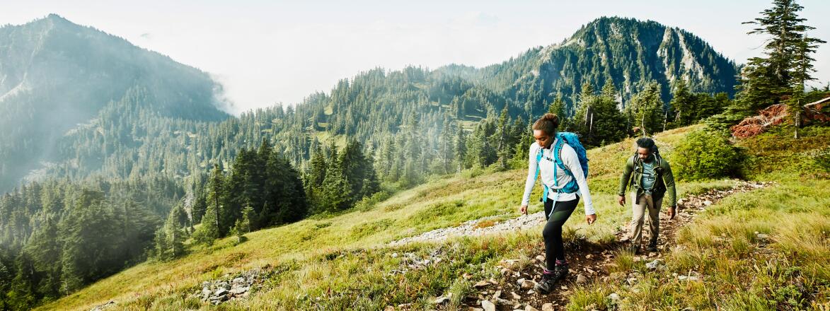 Female and male hiking in the mountains
