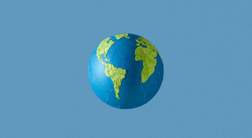 paper mache globe on blue background