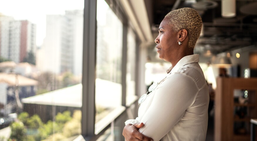 image_of_woman_looking_out_window_GettyImages-1258107707_1800