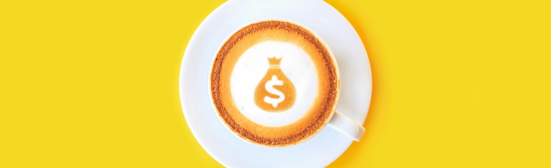 latte with dollar sign and money bag made out of the foam