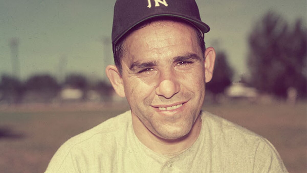 Larry Yogi Berra of the Yankees is seen here shaking hands with