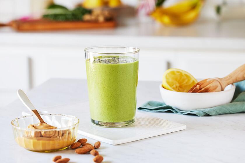 Summer smoothies styled on a white kitchen counter