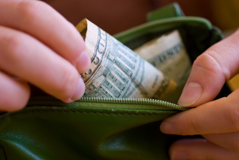 Wallet with dollar bills