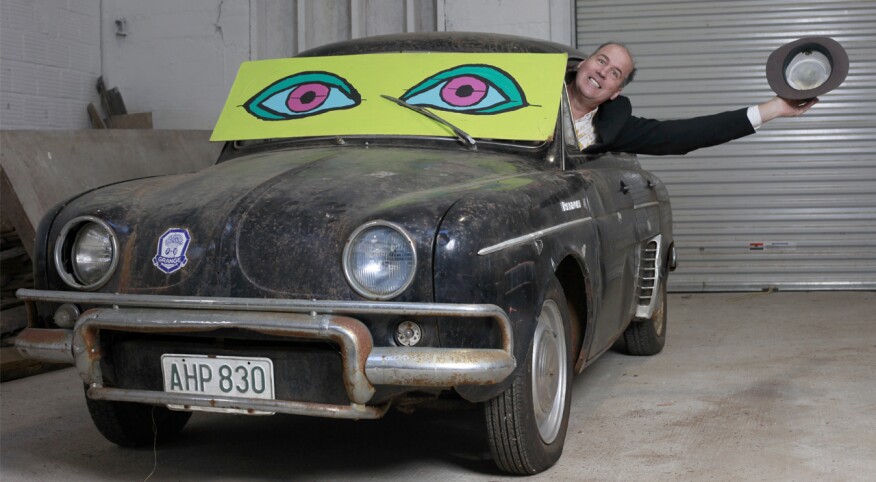 Krist Novaselic from Nirvana sticking his head out of a car with comical expression