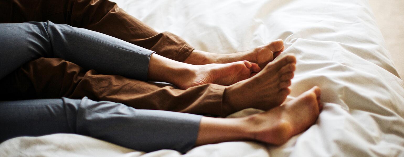 Married couple alone in bed while kids are at summer camp.