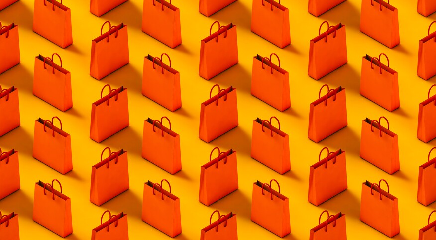 Pattern of red-orange shopping bag on a yellow background