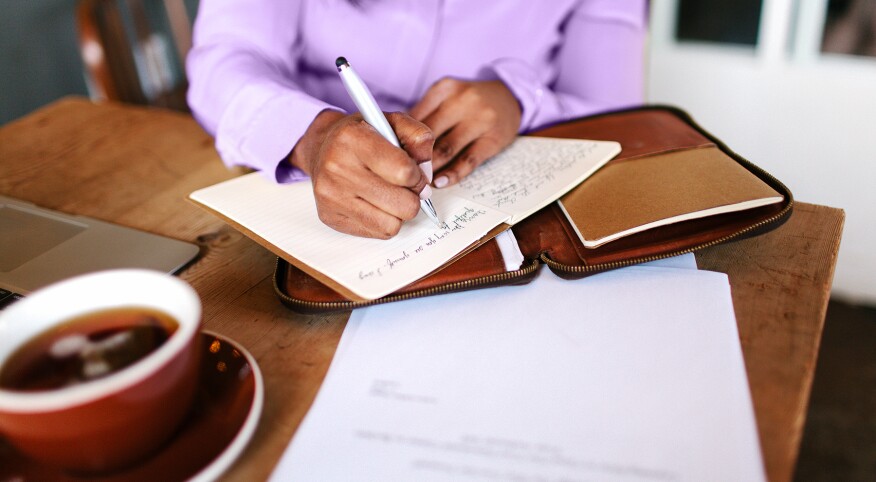 image_of_woman_writing_in_notebook_on_table_Stocksy_txp167eb4b0cCl200_OriginalDelivery_562091_v2_1800