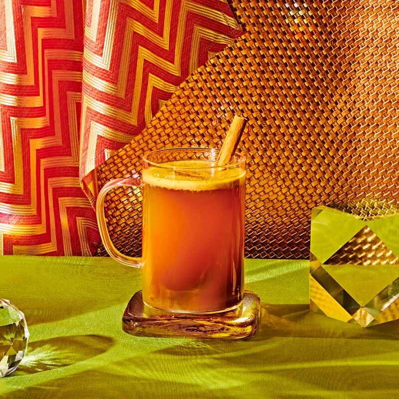 Beautiful Chai Hot Buttered Rum mocktail photographed in a warm light