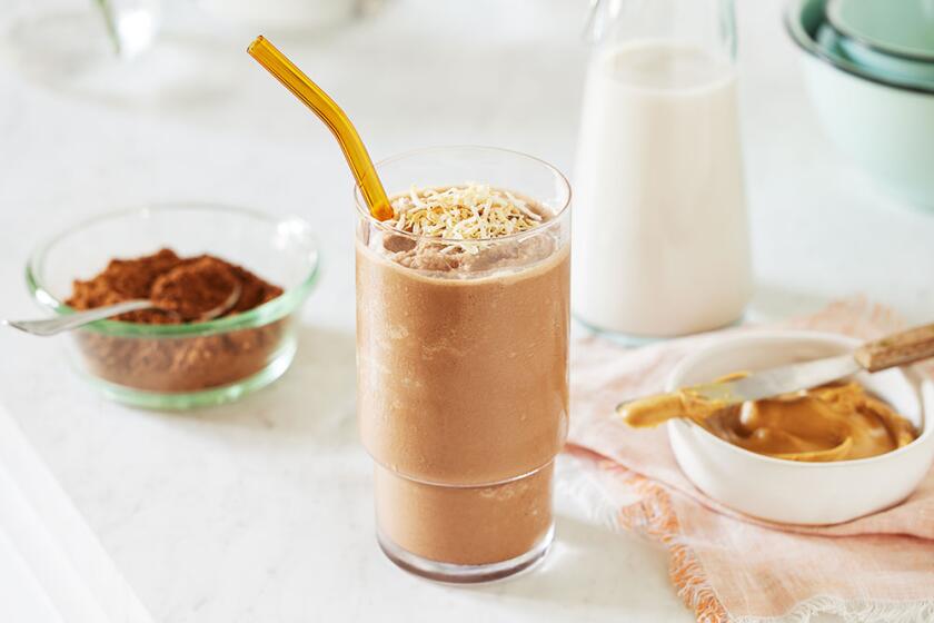 Summer smoothies styled on a white kitchen counter