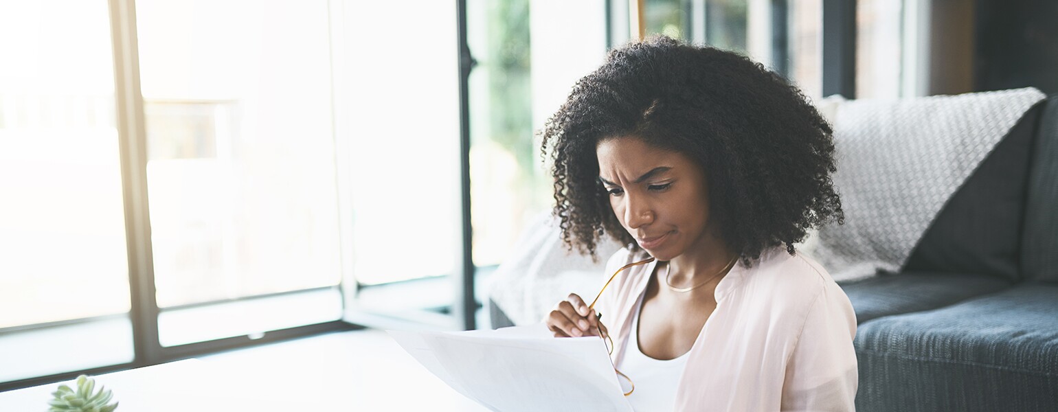 image_of_black_woman_looking_over_finances_GettyImages-1077209290_1540.jpg