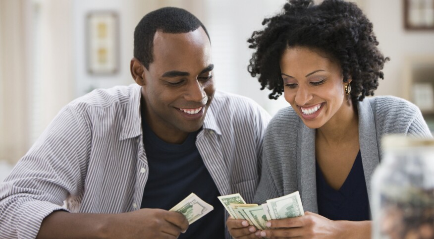 image_of_man_and_woman_counting_money_GettyImages-103919680_1800