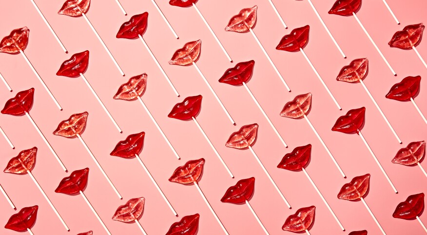 lip shaped suckers on a pink background