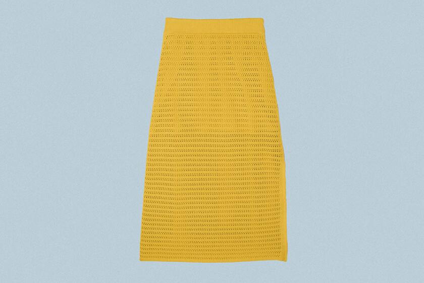 Yellow crochet skirt on grey background