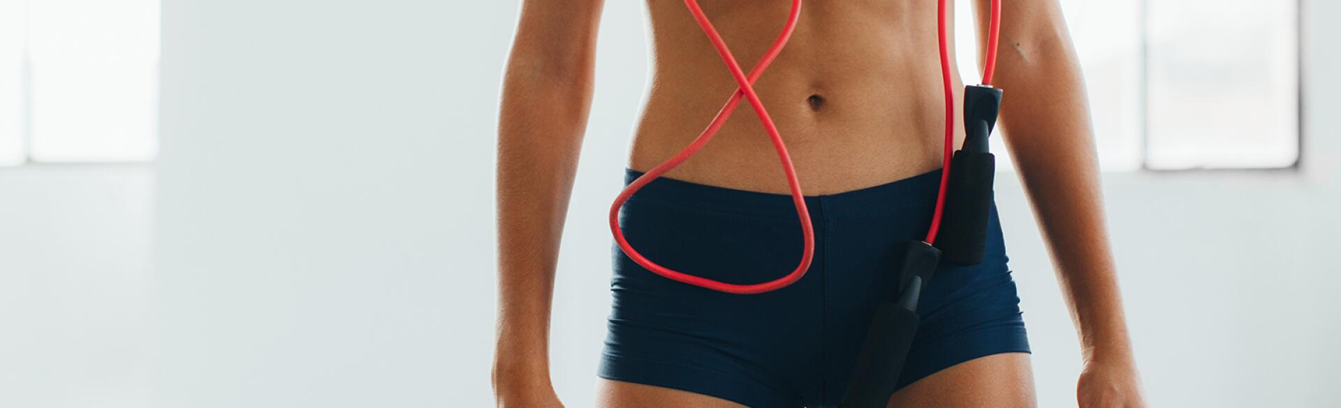 image_of_womans_flat_stomach_with_jumprope_hanging_from_neck_Stocksy_txpa33217d90LZ200_OriginalDelivery_1183186_1540.jpg