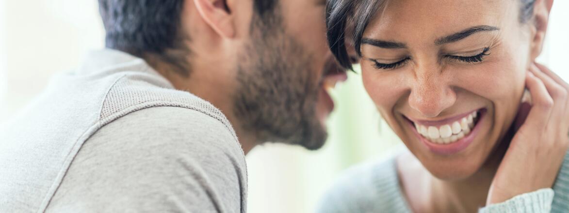 An image depicting a man over 40 speaking with a woman.