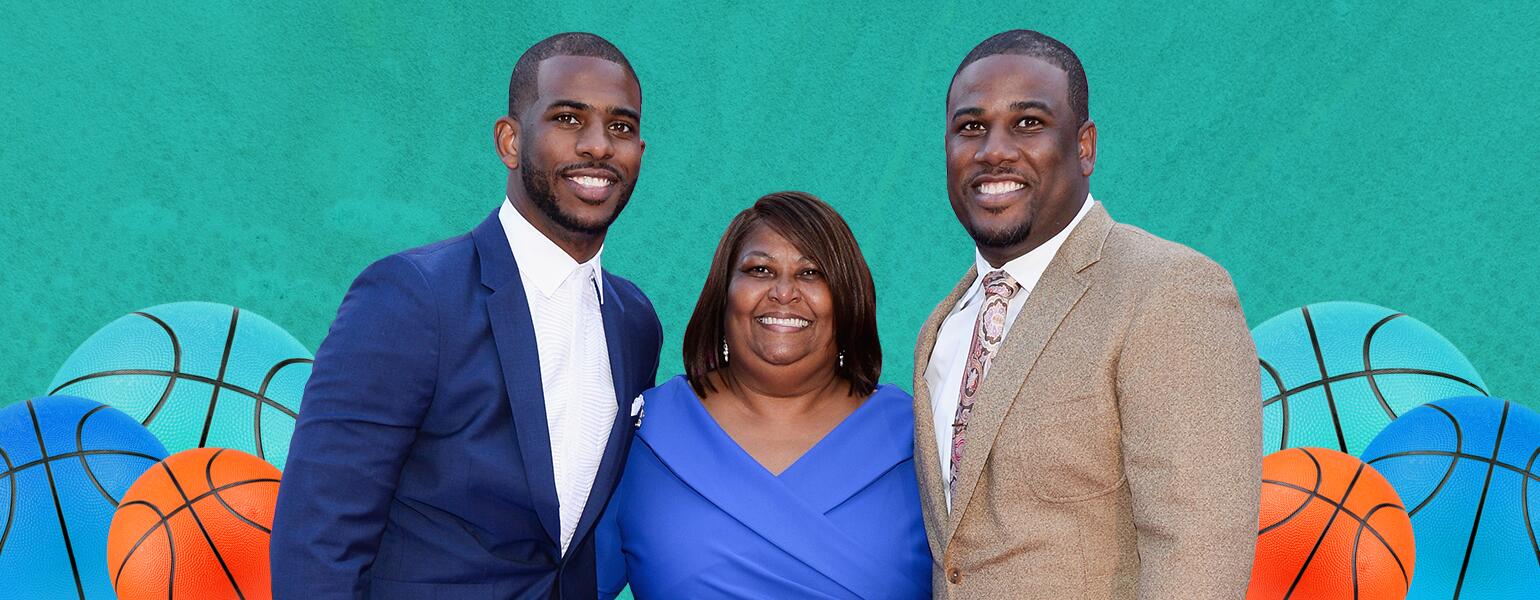 A mother stands in-between her two successful sons.