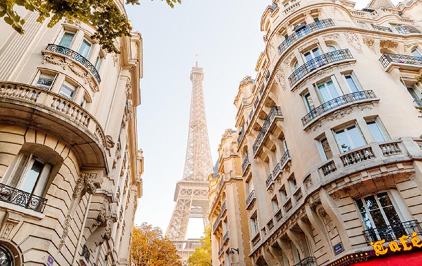 Eiffel Tower seen in the end of the street in Paris, France