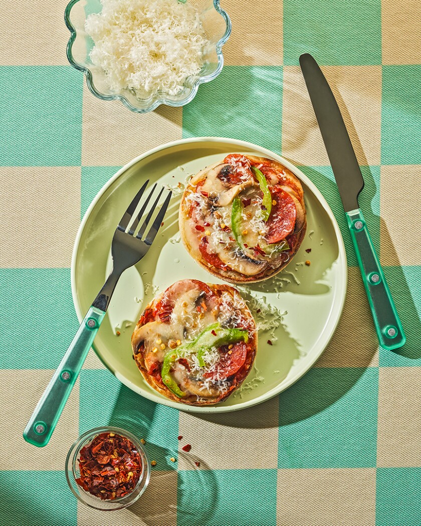 Two slices of Pizza toast from above on a checkered background