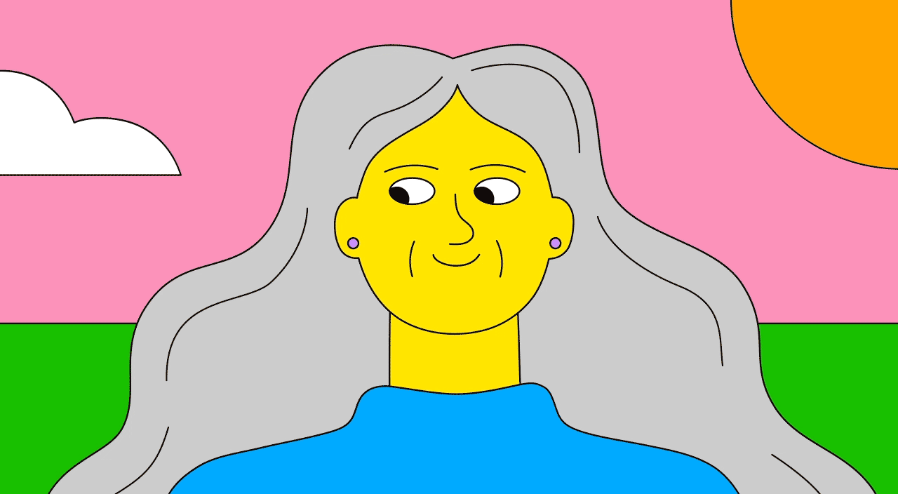 Woman admiring her long gray hair