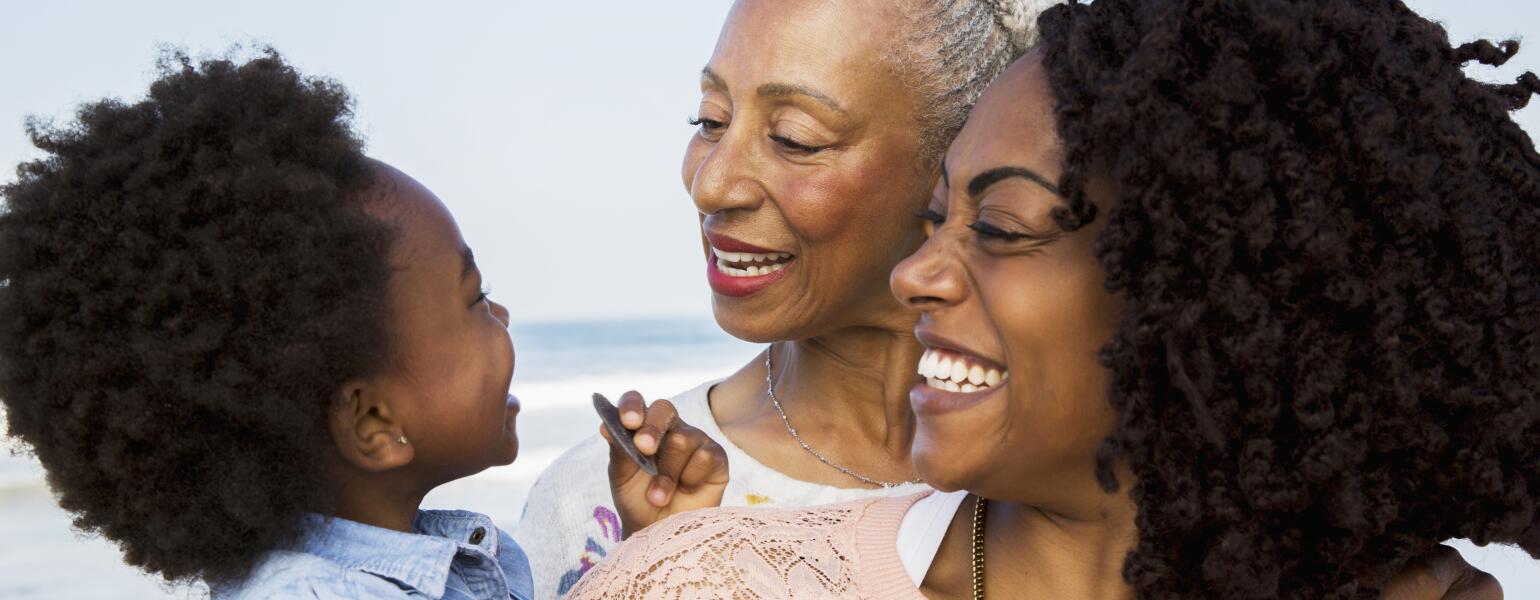 Sisters-grandmother-mother-baby-smiling-at-each-other-1540-GettyImages-905548688