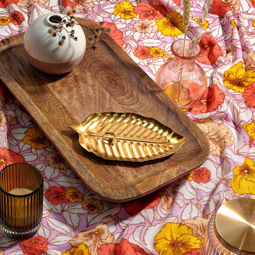 Gold leaf jewelry tray on wooden board