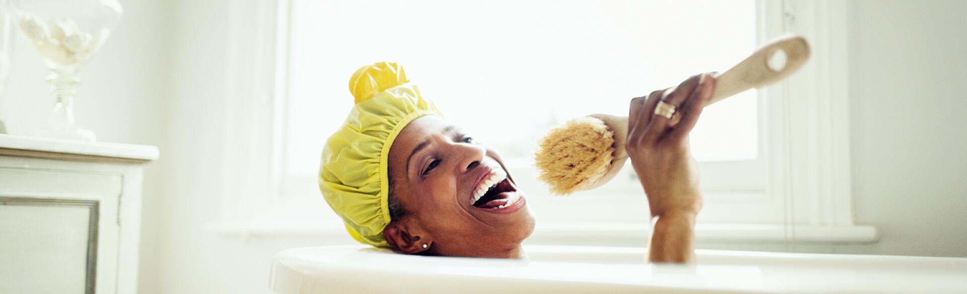 image_of_black_woman_in_bathub_with_shower_cap_GettyImages-639546321_1540.jpg