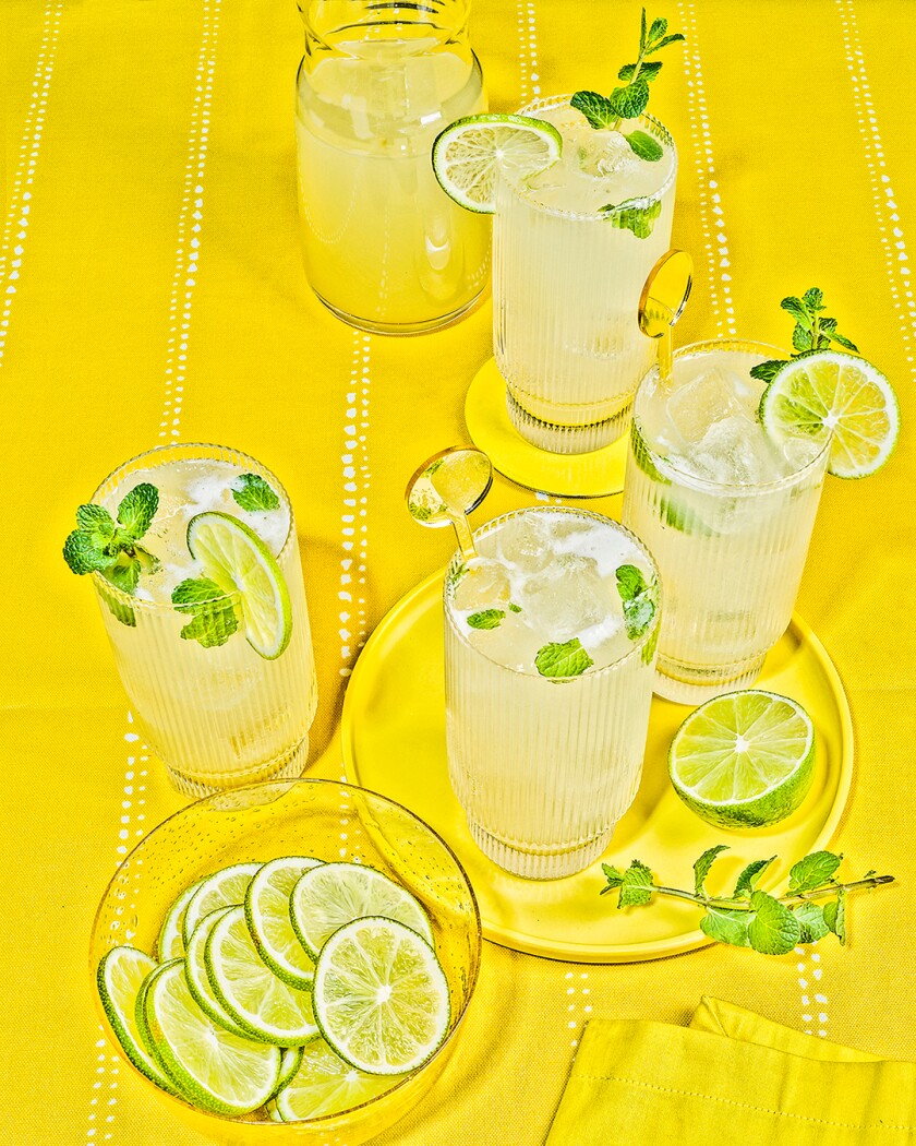 Mojito cocktails on bright yellow background 