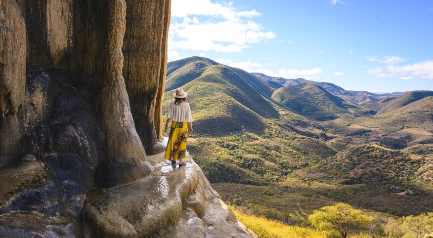 Female tourist exploring the petrified waterfalls at Hierve el Agua, Oaxaca, Mexico