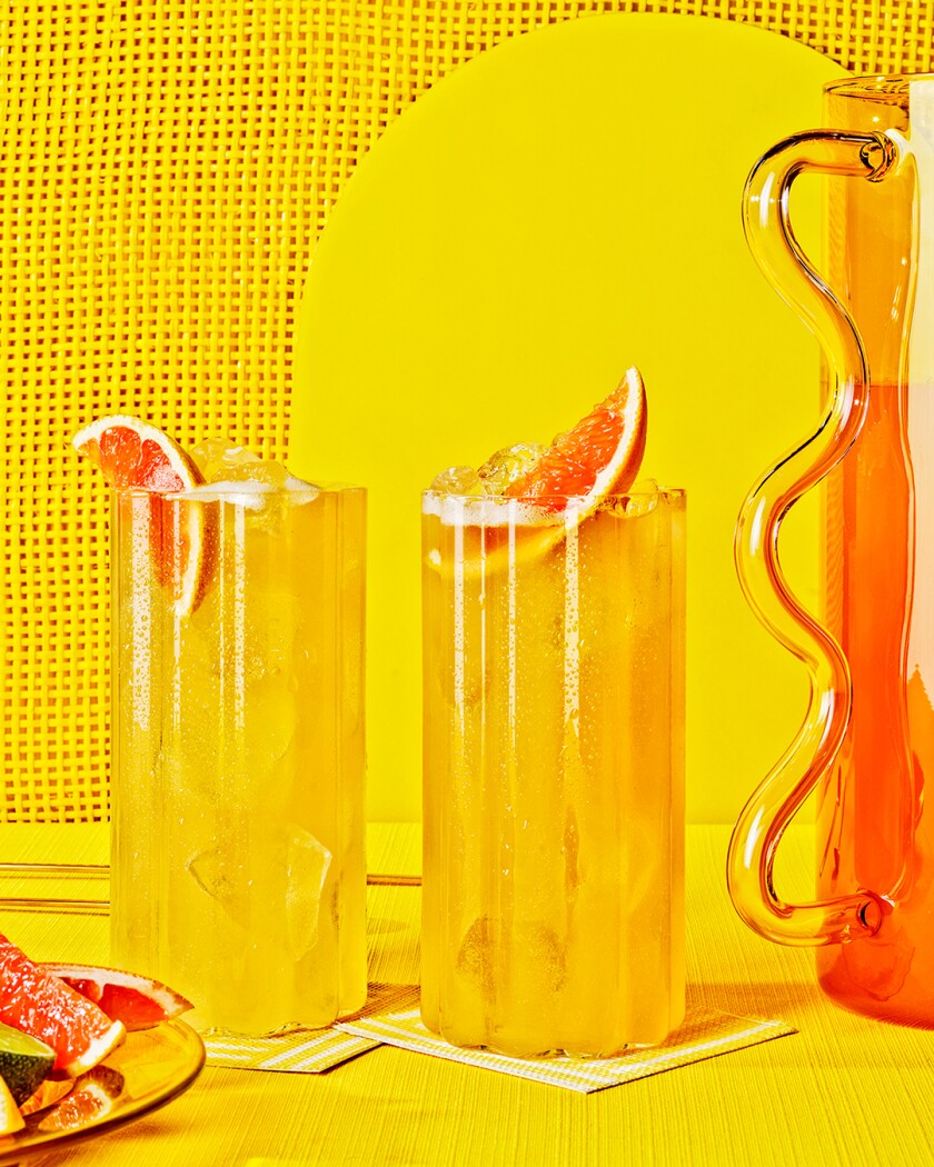 Paloma cocktails on bright yellow background