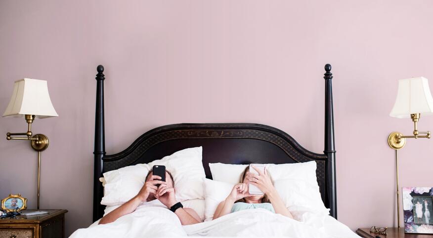 On The Morning Of A 40th Birthday, A Couple Unenthusiastically Check Their Phones