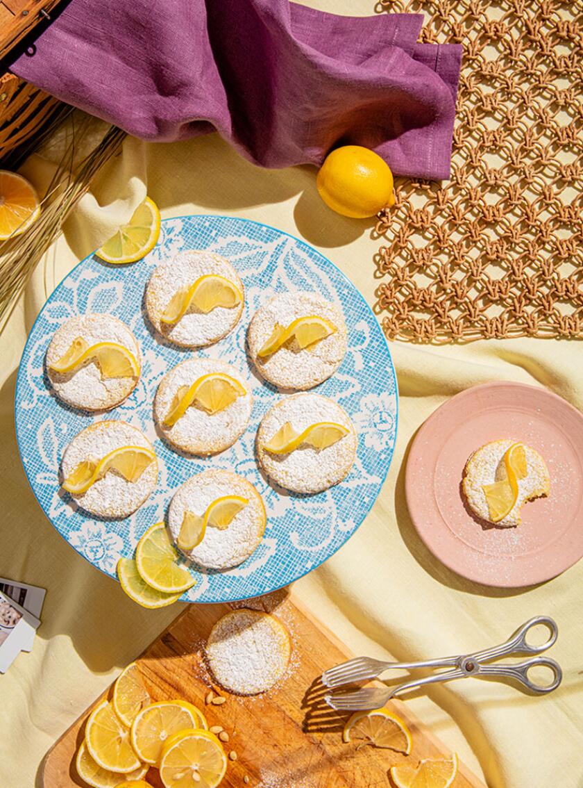 Picnic food featuring lemon dream cookies styled with bright spring and summer accents