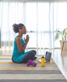 image_of_woman_meditating_with_hands_together_GettyImages-1251369317_1800