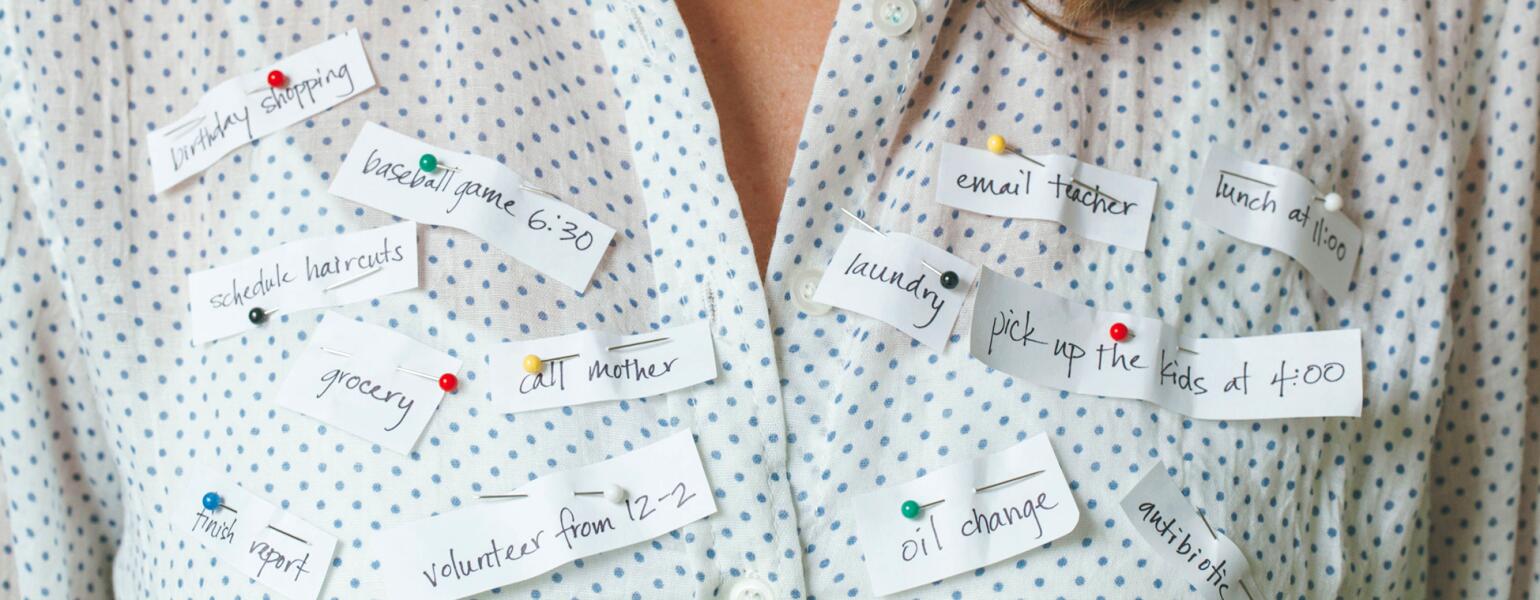 Busy Woman With Reminders Pinned To Her Shirt