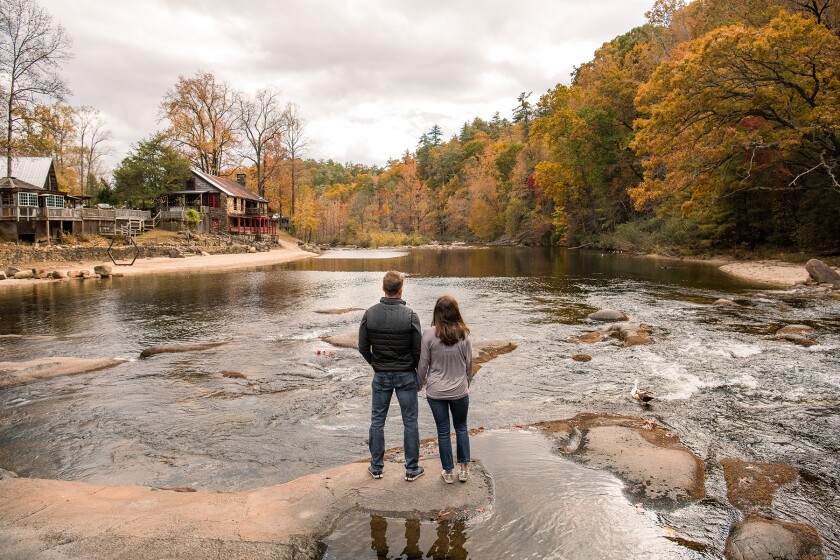 Couple at Pinewood Therapy, viewing fall foliage