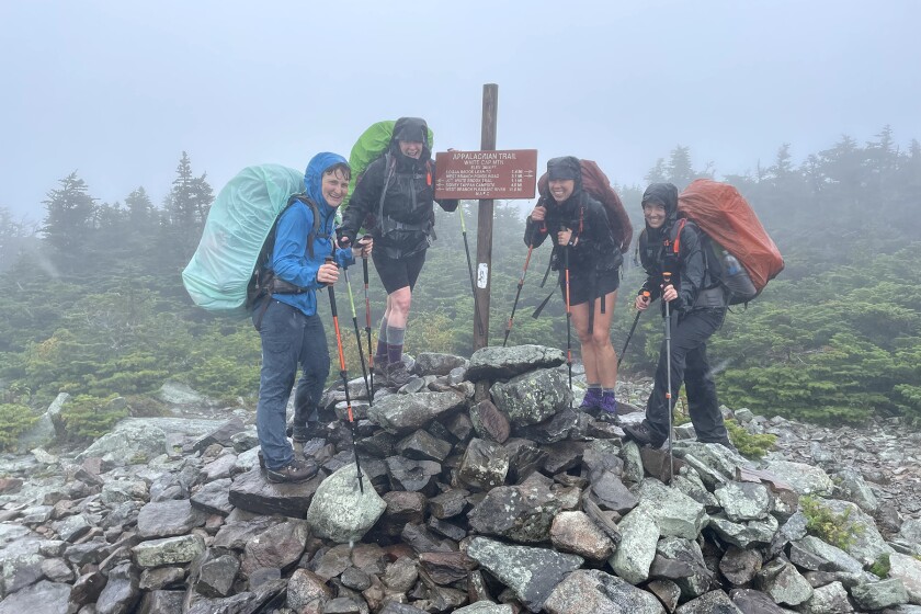 White Cap Mountain in wind‐ driven rain and fog. L‐R (Courtney, Catherine, Chloe, Meghan) On the Appalachian Trail in Maine’s 100‐Mile Wilderness