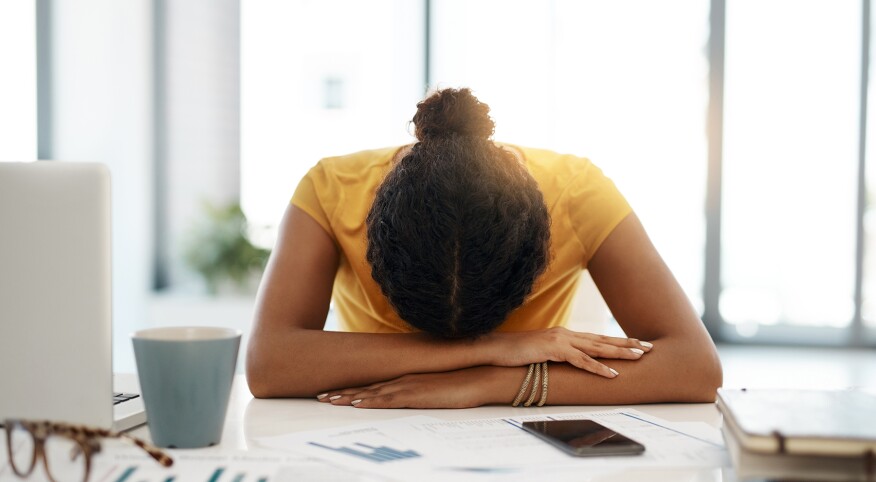 image_of_woman_with_head_down_on_desk_GettyImages-1064567962_1800