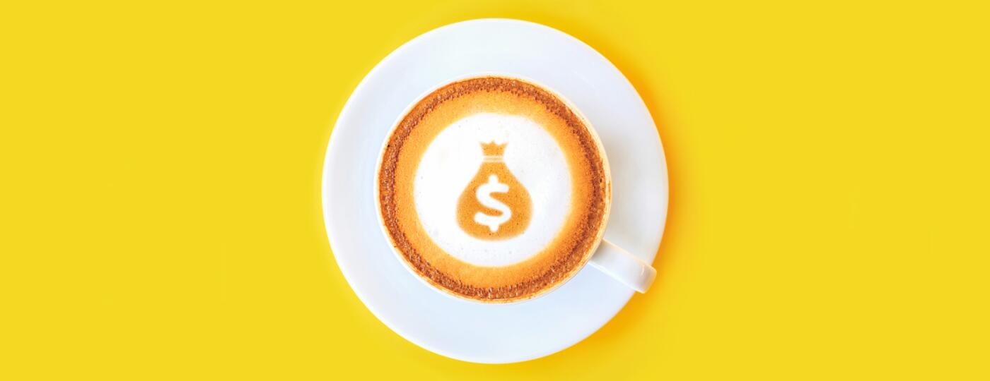latte with dollar sign and money bag made out of the foam