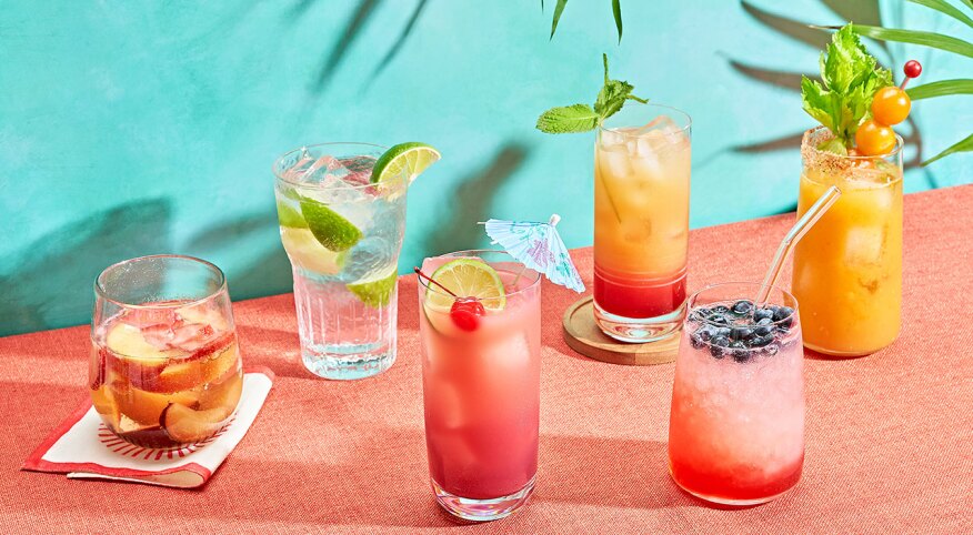 Sunset summer cocktail styled on colorful background