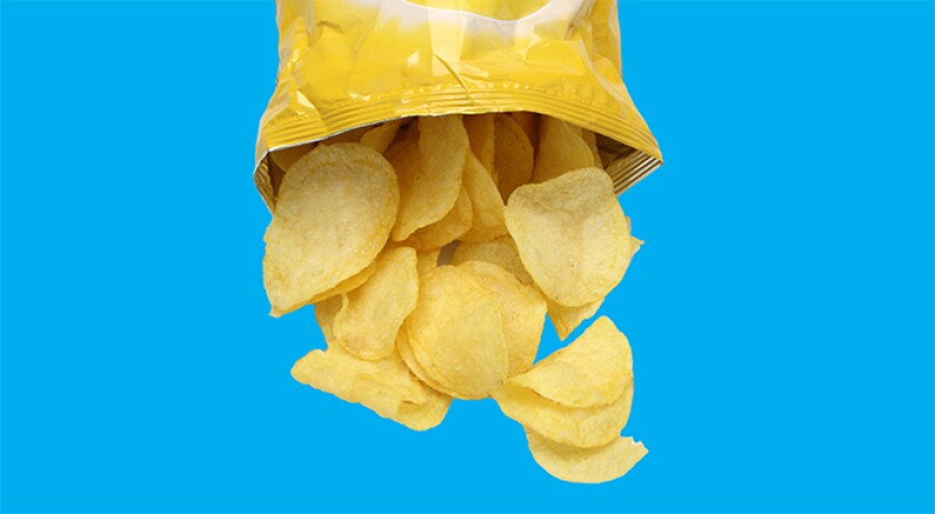 photo of potato chips on blue background