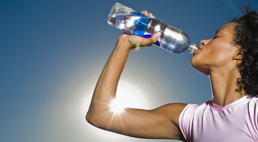 African woman drinking water