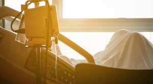 Cropped view of someone laying in a hospital bed