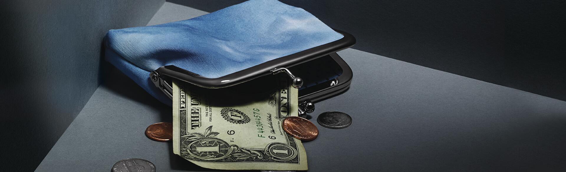coin purse with money coming out