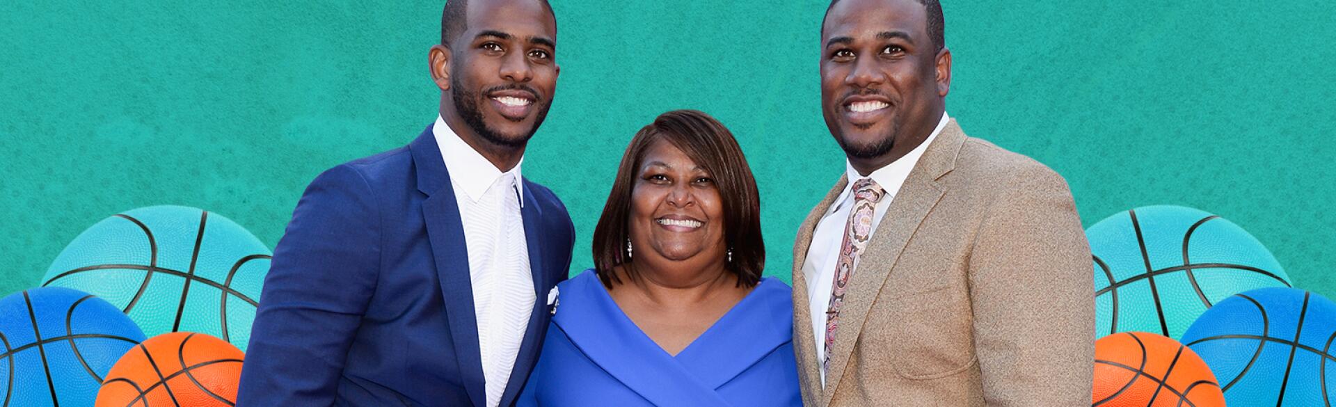 A mother stands in-between her two successful sons.