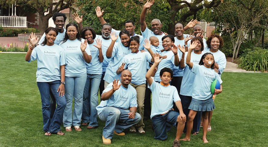 Multi generational family waving at reunion