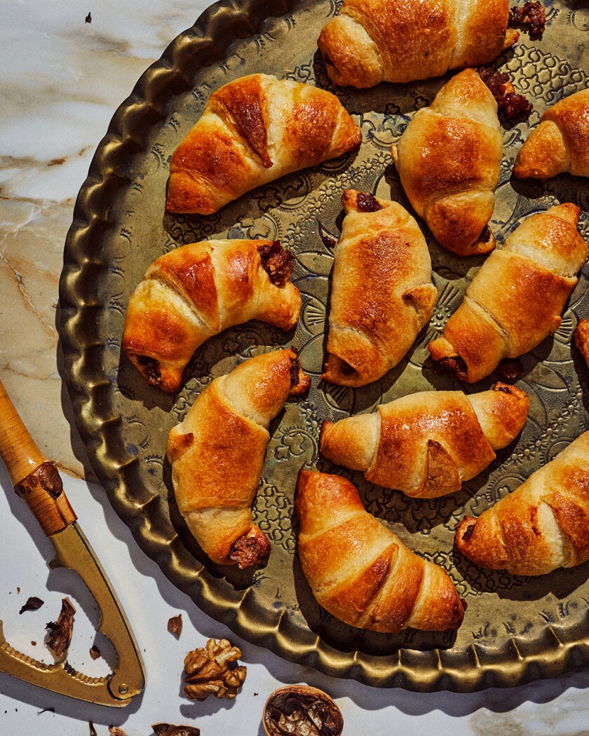 Sausage crouissants on a gold serving tray