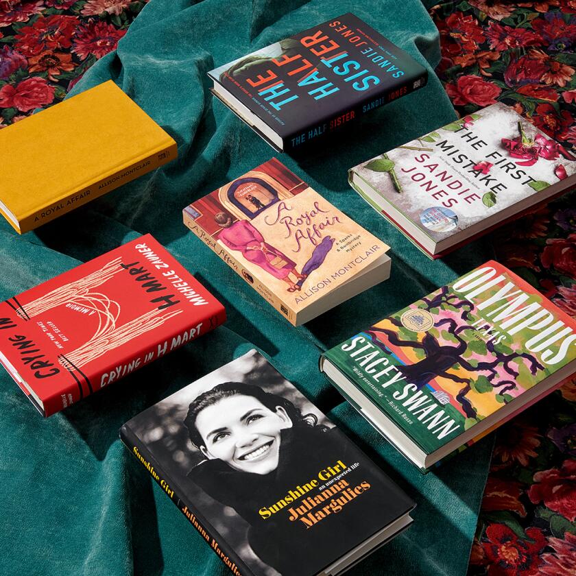 Seven books laid out on tabletop