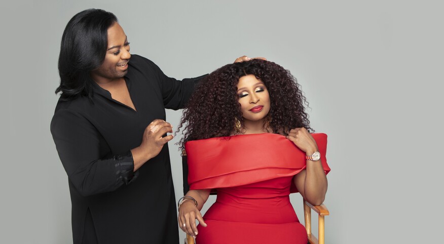 Woman getting fitted for wig by stylist