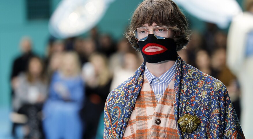 A photo of a model from the Gucci fashion show, featuring a face warmer made to resemble blackface.