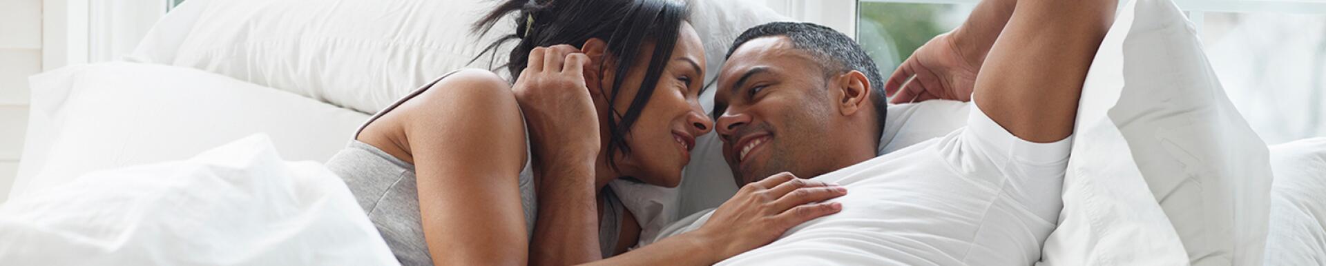 image of couple in bed